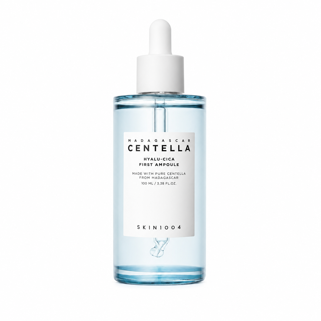 A clear dropper bottle of SKIN1004 Madagascar Centella Hyalu-Cica First Ampoule containing a light blue liquid, featuring a white minimalist label and white dropper cap.
