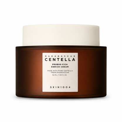 A jar of SKIN1004 Madagascar Centella Probio-Cica Enrich Cream featuring a dark amber glass-style base, a white screw-on cap, and a clean white label with minimalist text.