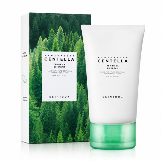 SKIN1004 Madagascar Centella Tea-Trica B5 Cream in a white squeeze tube with a green cap, standing next to its rectangular product packaging box featuring a green pine forest design.